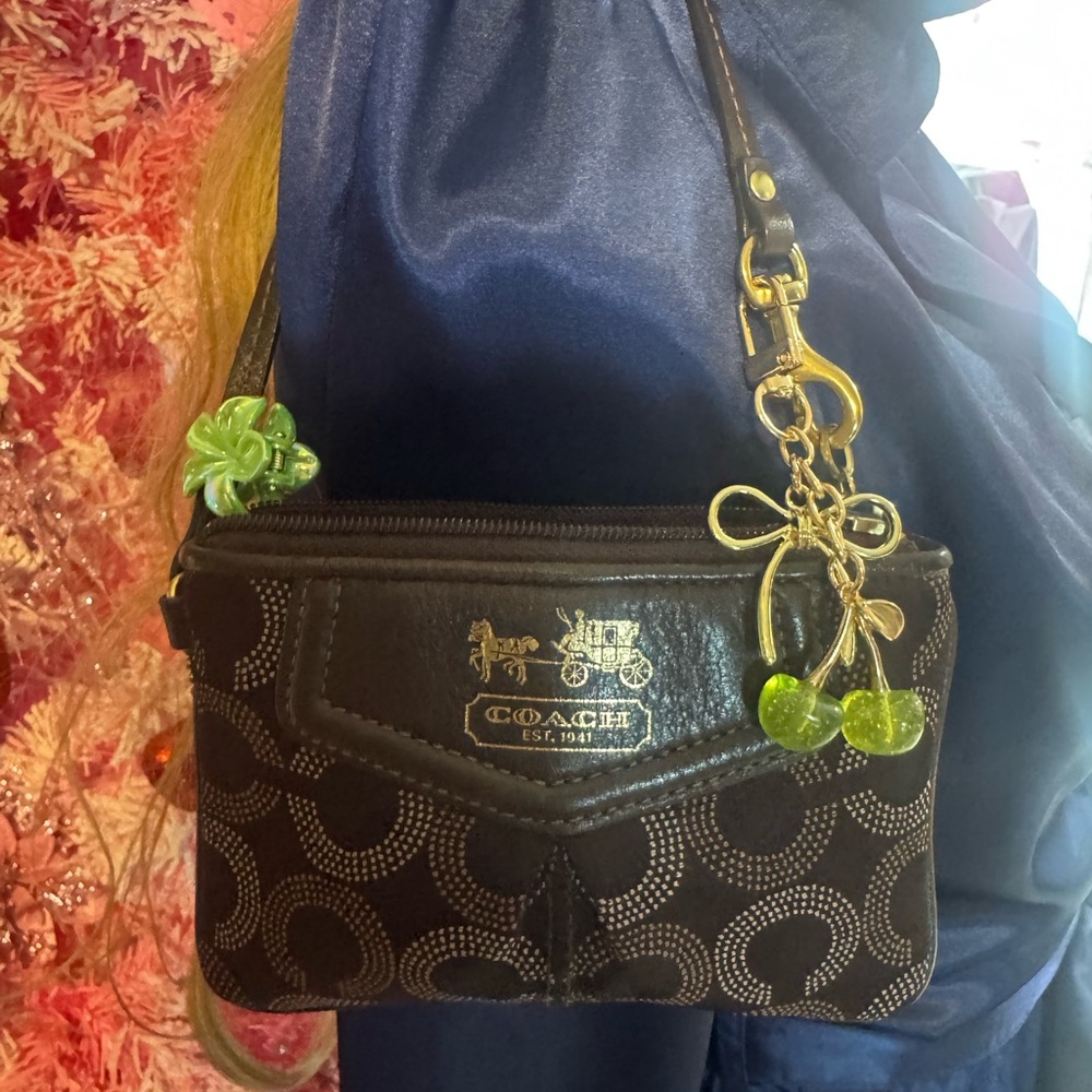 Coach Black Signature Wristlet with Gold Hardware and Green Charm Accent